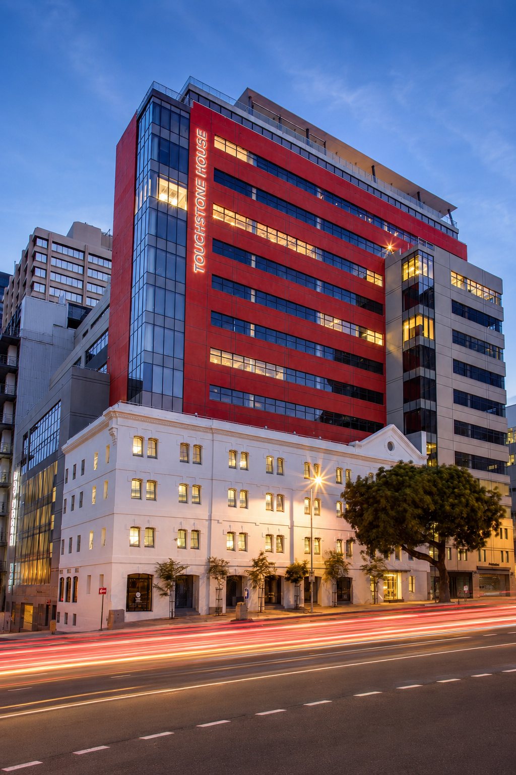 Touchstone House at dusk, the red tower at 7 Bree Street, Cape Town City Centre, where RLP Accounting occupies the 14th floor.
